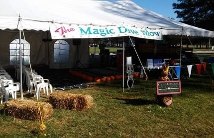 Holiday party magic show setup with themed decorations